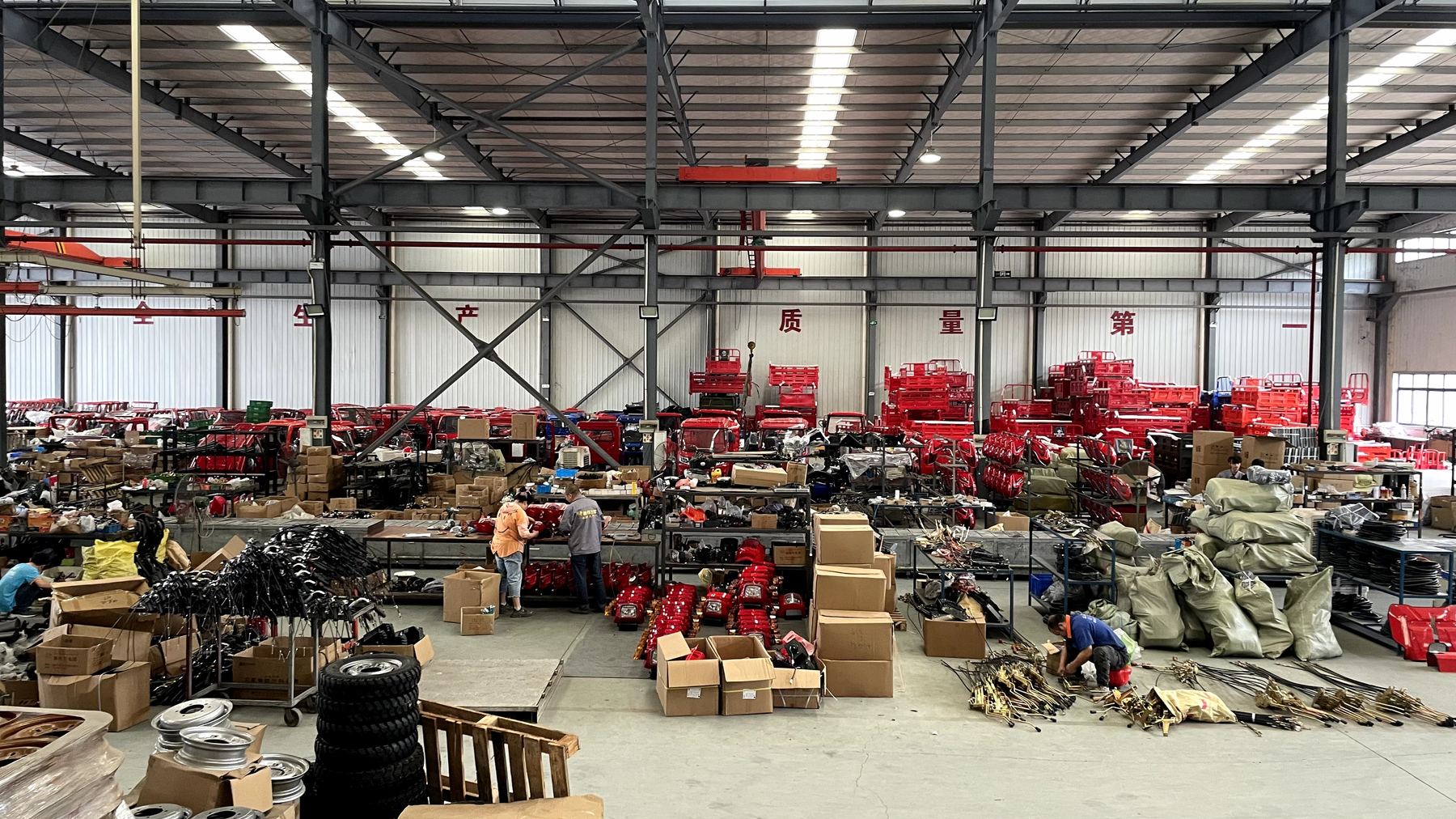 Large spare parts workshop with tricycle components