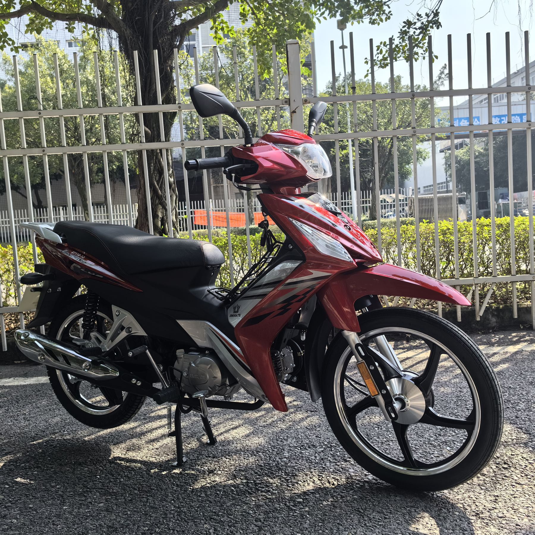 Red two-wheel motorcycle for daily transport