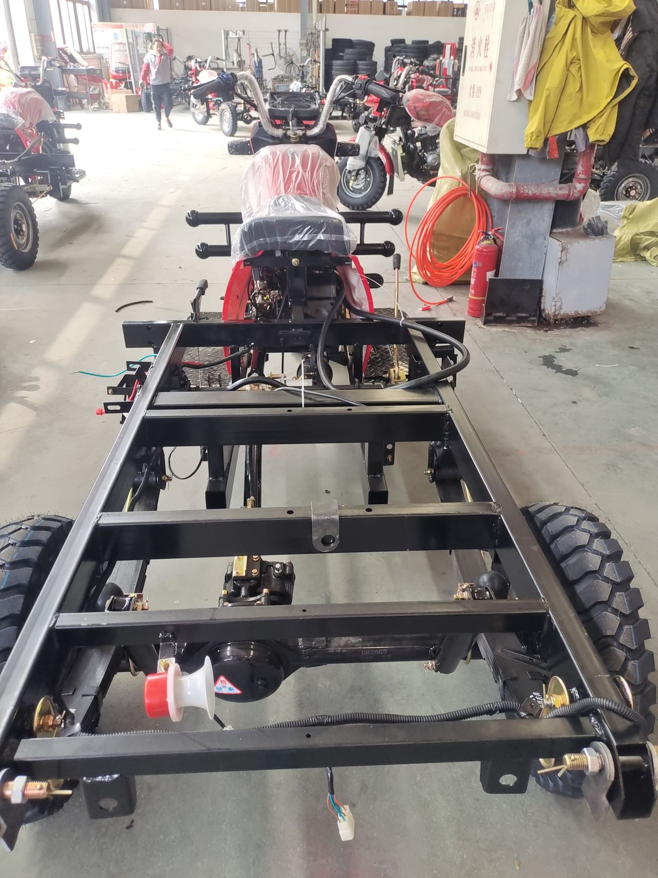 Rear view of semi-finished tricycle chassis in the workshop
