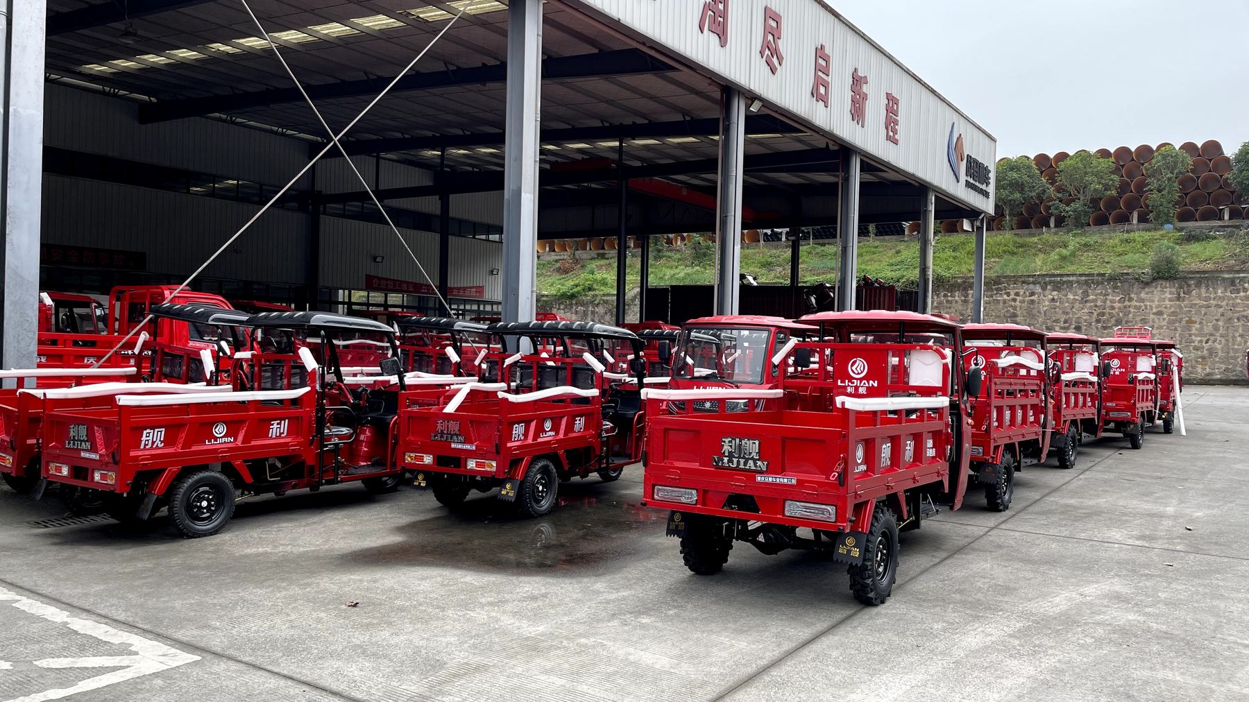 Finished red cargo tricycles prepared in the factory yard